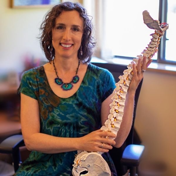 Dr Deborah Diamond D.S. explaining spinal injuries